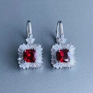 Radiant Sterling Silver Earrings with simulated ruby surrounded by CZ diamonds.